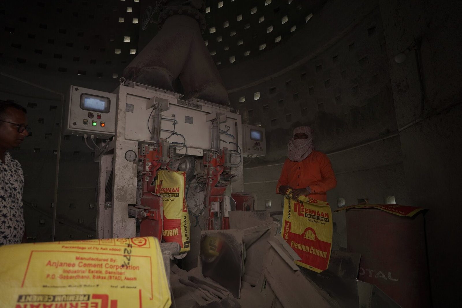 Factory Worker Packing Cement